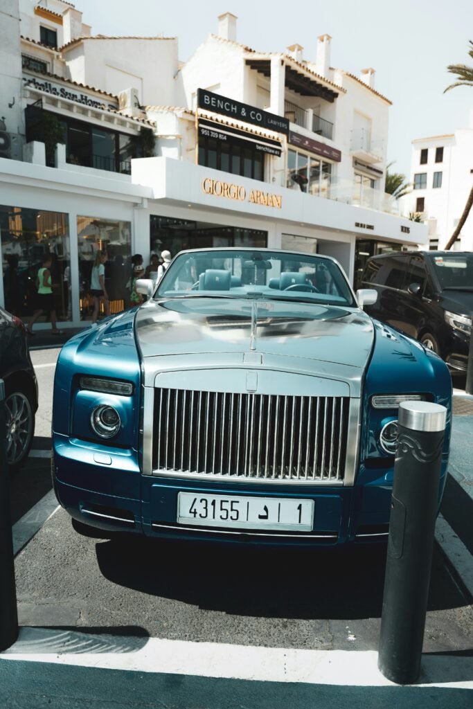 A rolls royce parked on the side of the road